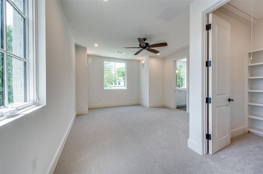 Spare room featuring light colored carpet, attic access, recessed lighting, and ceiling fan