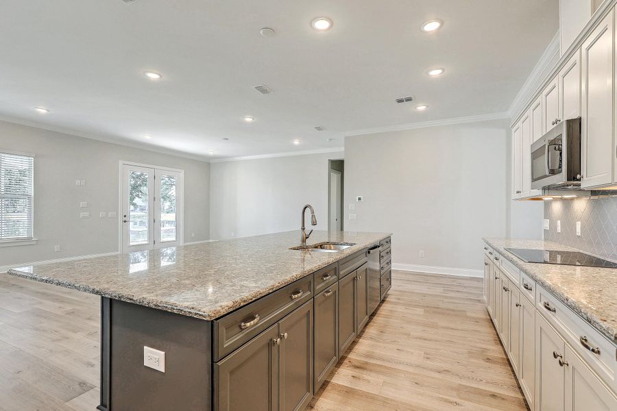 Furnished interior view inside a new home in K. Hovnanian's® Four Seasons at Lakes of Cane Bay, Summerville (Image 9).