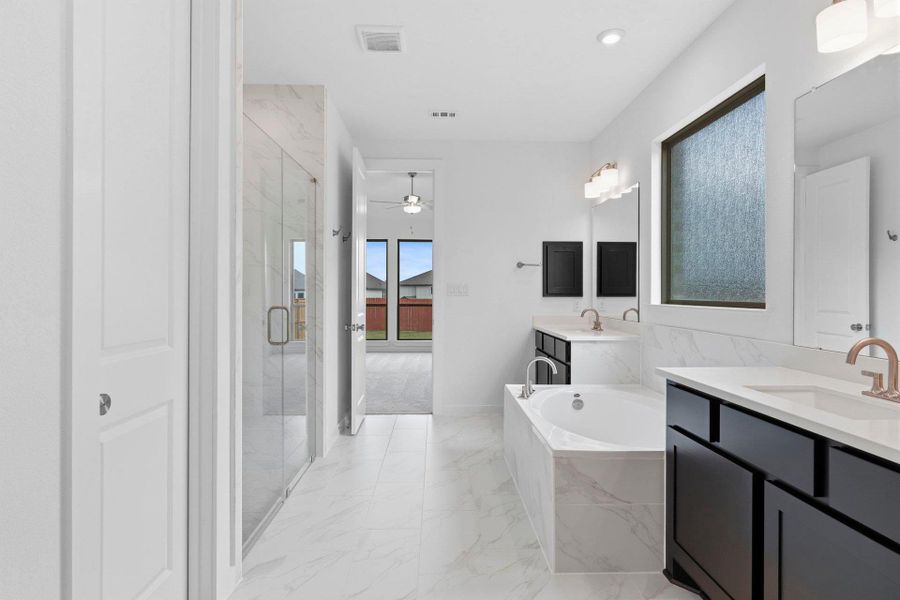 Primary Bath retreat with dual vanities, garden tub & walk-in shower