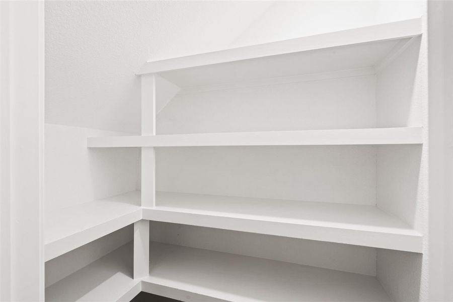 Thoughtfully designed built-in shelving maximizes every inch of space, offering practical, well-lit storage that keeps the home’s clean, modern aesthetic consistent throughout.