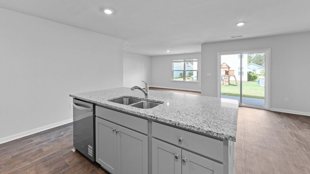 Representative furnished interior of a home built from the Cali by D.R. Horton in Center Pointe, Santee (Image 5).