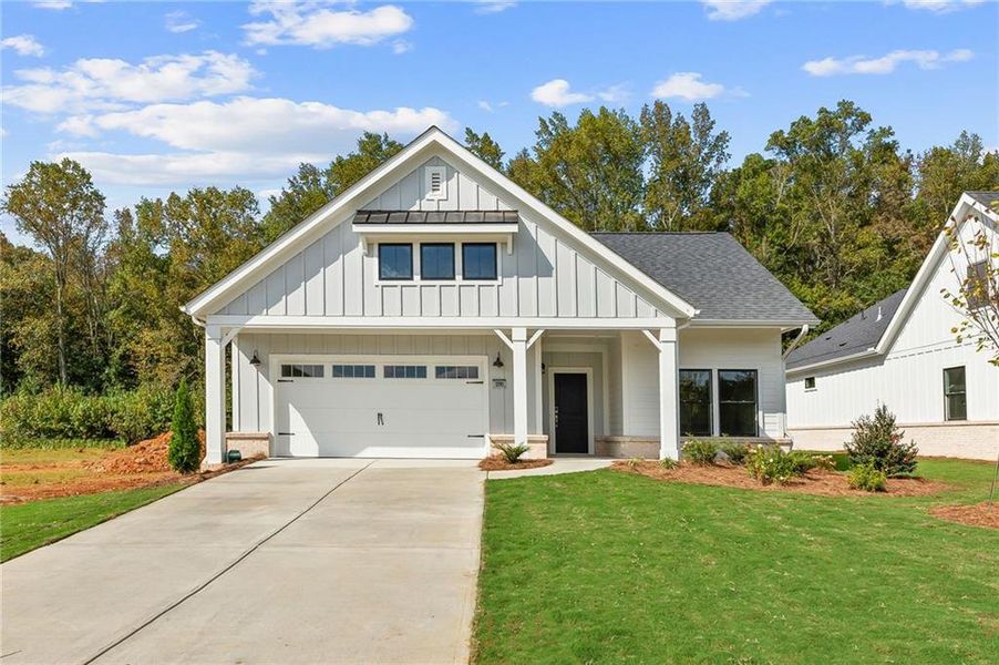 Front exterior of a new home in The Courtyards by The Manor, Alpharetta, GA, highlighting curb appeal (Image 2).