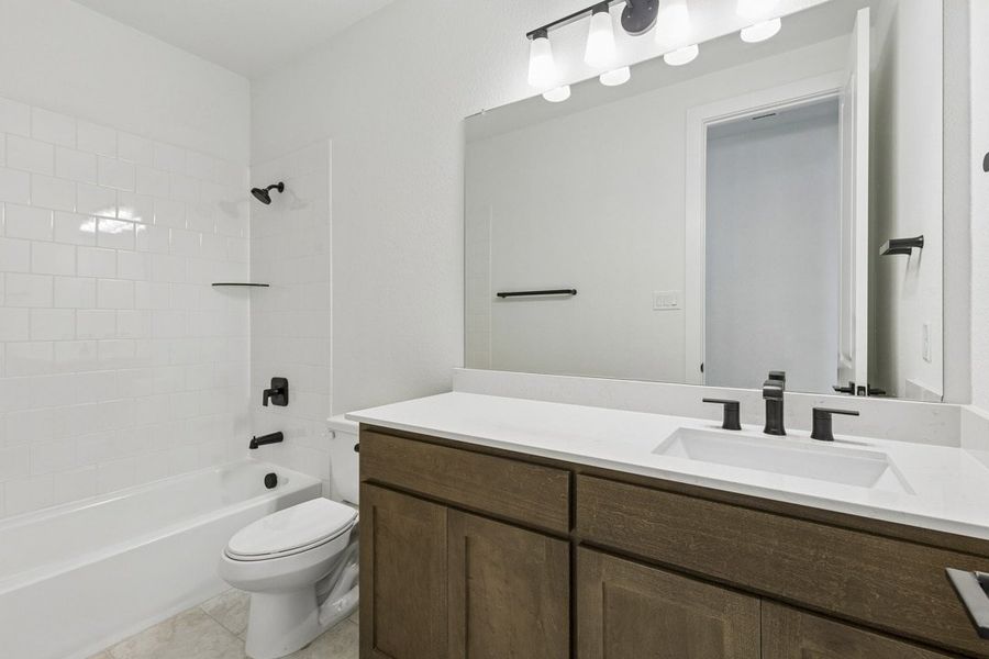 Furnished interior view inside a new home in Brahman Ranch, Venus (Image 13).