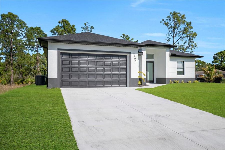 Front exterior of a new home in , Lehigh Acres, FL, highlighting curb appeal (Image 25). Front exterior of a new home in , Lehigh Acres, FL, highlighting curb appeal (Image 25).