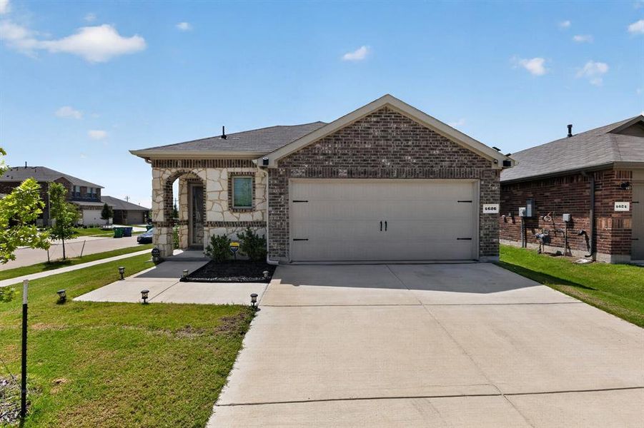 Front exterior of a new home in , Crandall, TX, highlighting curb appeal (Image 21). Front exterior of a new home in , Crandall, TX, highlighting curb appeal (Image 21).