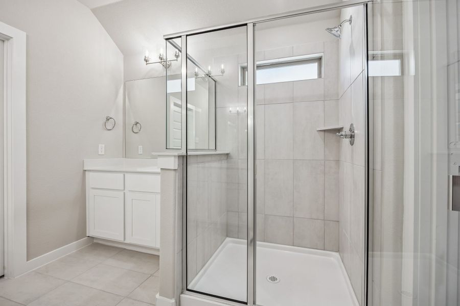 Primary Bathroom in the Heisman home plan by Trophy Signature Homes – REPRESENTATIVE PHOTO