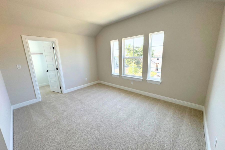 Multi-pane windows overlook the neighborhood from this comfortable bedroom with soft carpet flooring. Multi-pane windows overlook the neighborhood from this comfortable bedroom with soft carpet flooring.