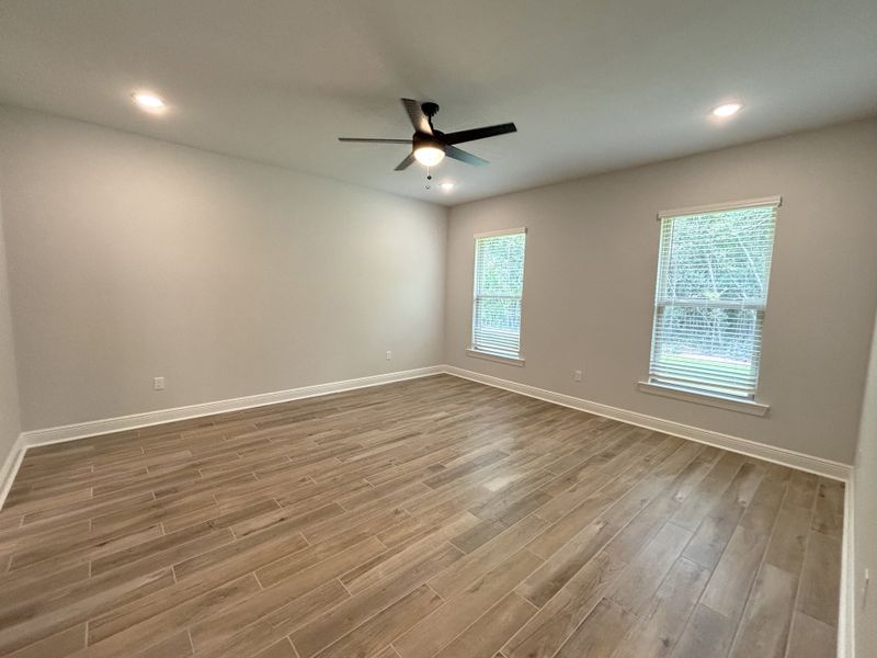 Spacious, unfurnished interior of a new home in Bird Song at Hammock Bay, Freeport (Image 28).