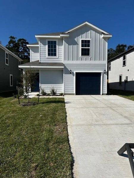 Front exterior of a new home in Townsend Reserve, Splendora, TX, highlighting curb appeal (Image 2). Front exterior of a new home in Townsend Reserve, Splendora, TX, highlighting curb appeal (Image 2).