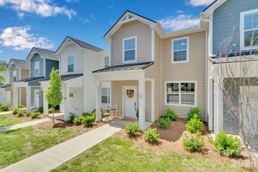 Front exterior of a new home in , Concord, NC, highlighting curb appeal (Image 24).