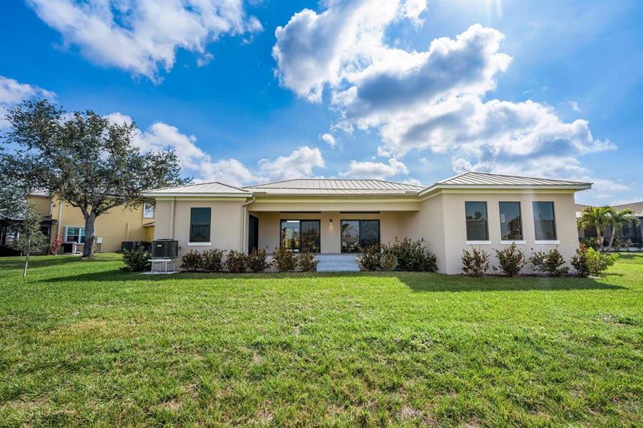 Front exterior of a new home in , Punta Gorda, FL, highlighting curb appeal (Image 2).
