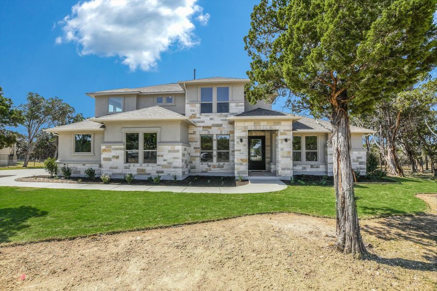 Representative exterior photo of a completed home built from the Vanderpool II by Giddens Homes in Whispering Wind, Bertram, TX (Image 29).