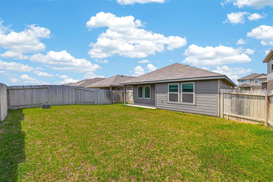 Exterior details and patio area of a home in Breckenridge Forest, Spring (Image 27).