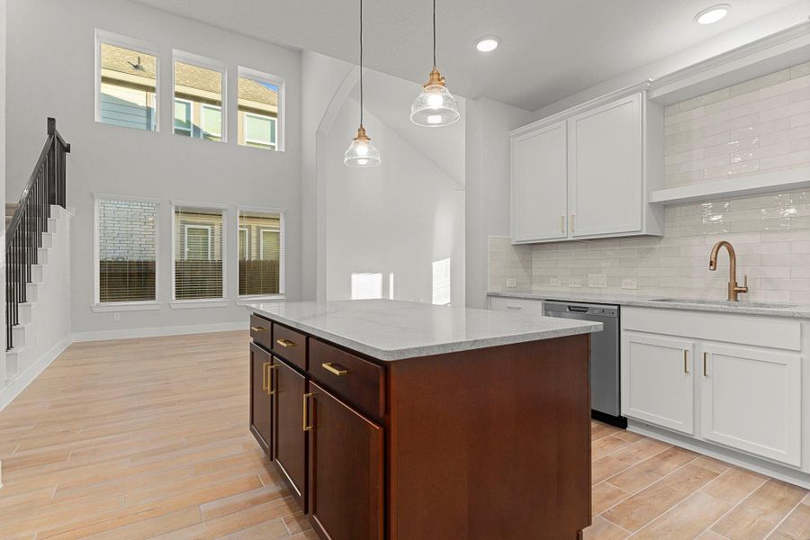 Adjacent to the kitchen, the inviting dining area offers a bright and open space for family meals—beautifully enhanced by tall windows and natural light that fill the room. Adjacent to the kitchen, the inviting dining area offers a bright and open space for family meals—beautifully enhanced by tall windows and natural light that fill the room.