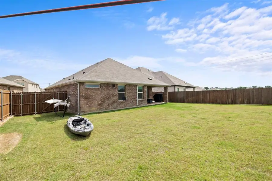Exterior details and patio area of a home in Stonehaven, Seagoville (Image 3).