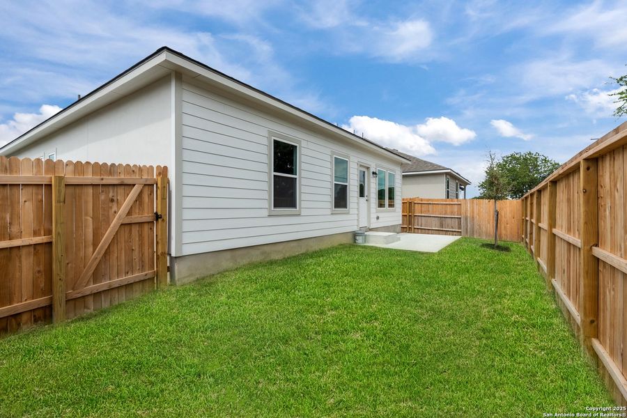 Front exterior of a new home in August Fields, New Braunfels, TX, highlighting curb appeal (Image 17).