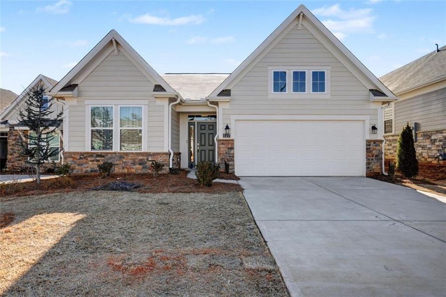 Front exterior of a new home in Laurel Farms, Dallas, GA, highlighting curb appeal (Image 21).