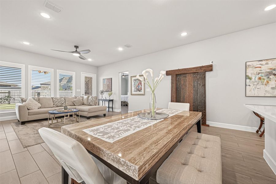 This row of windows in the living room floods the space with wonderful natural light. (Note: Photo is staged; property is currently vacant.) This row of windows in the living room floods the space with wonderful natural light. (Note: Photo is staged; property is currently vacant.)