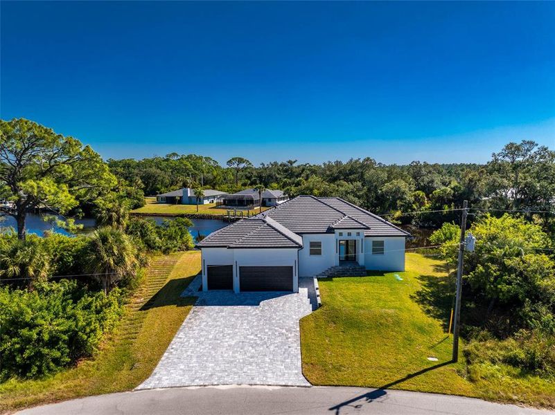 Front exterior of a new home in , Port Charlotte, FL, highlighting curb appeal (Image 26). Front exterior of a new home in , Port Charlotte, FL, highlighting curb appeal (Image 26).