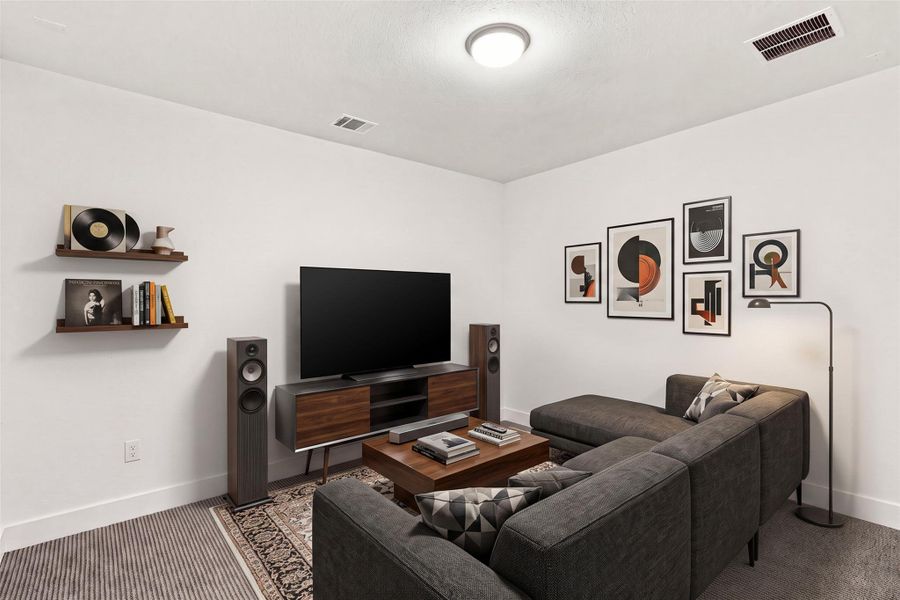 Plush carpeting underfoot complements the smooth walls in this quiet media space.