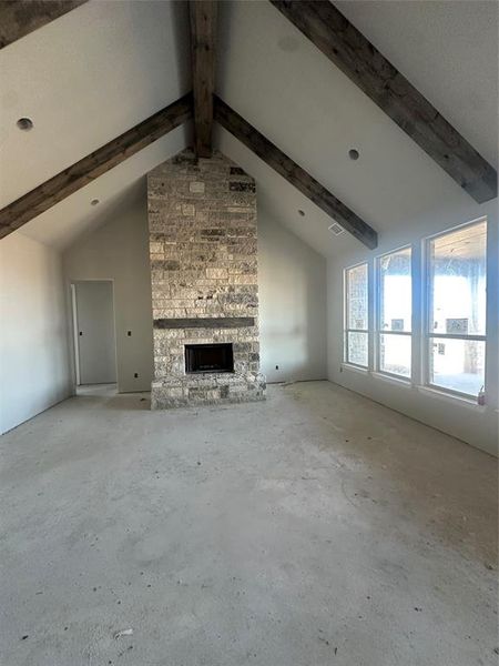 Living with fireplace and stained beams