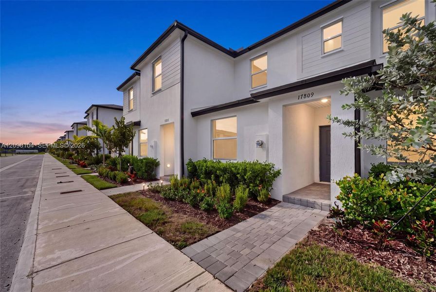 Front exterior of a new home in , Homestead, FL, highlighting curb appeal (Image 17).
