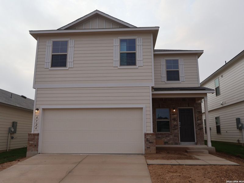 Front exterior of a new home in Winding Brook, San Antonio, TX, highlighting curb appeal (Image 2). Front exterior of a new home in Winding Brook, San Antonio, TX, highlighting curb appeal (Image 2).