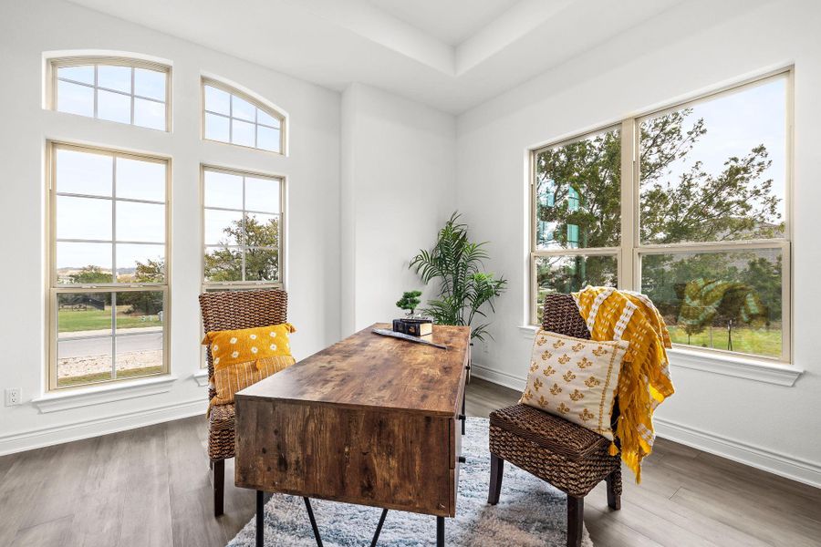 Dining space with wood finished floors and baseboards