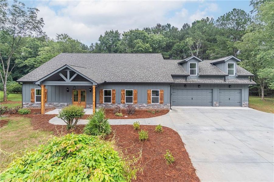 Front exterior of a new home in , Braselton, GA, highlighting curb appeal (Image 25).