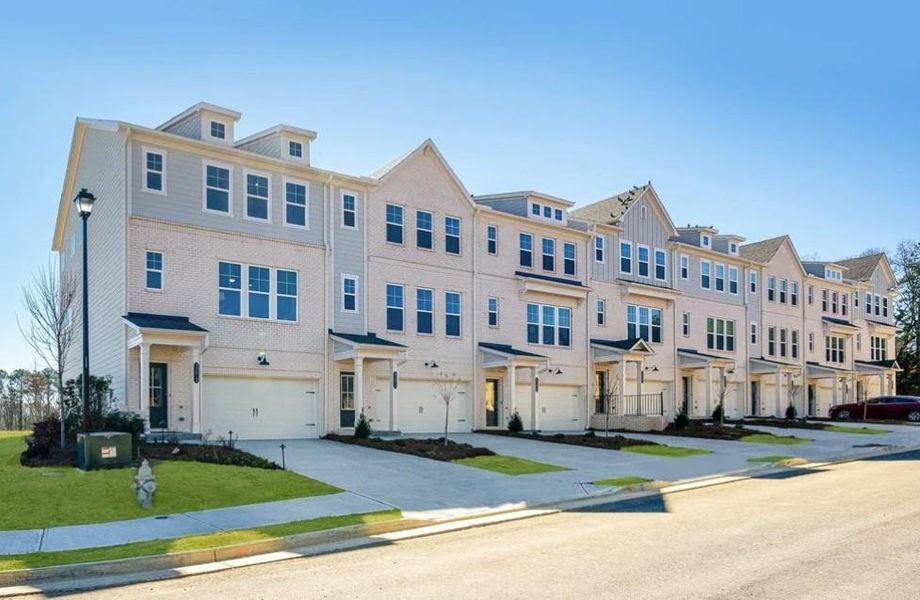 Front exterior of a new home in Auburn Glen, Dacula, GA, highlighting curb appeal (Image 1). Front exterior of a new home in Auburn Glen, Dacula, GA, highlighting curb appeal (Image 1).