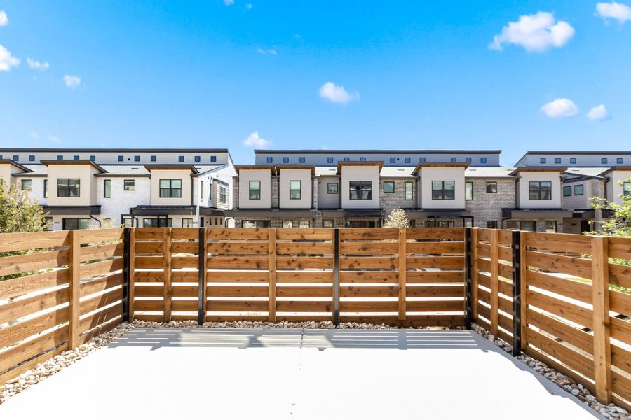 Exterior details and patio area of a home in Willow Grove Townhomes, Melissa (Image 29).
