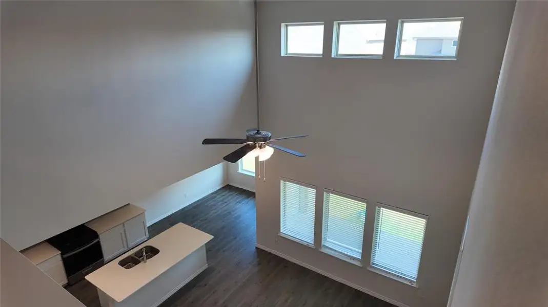 Detailed view of a ceiling fan and wood finished floors