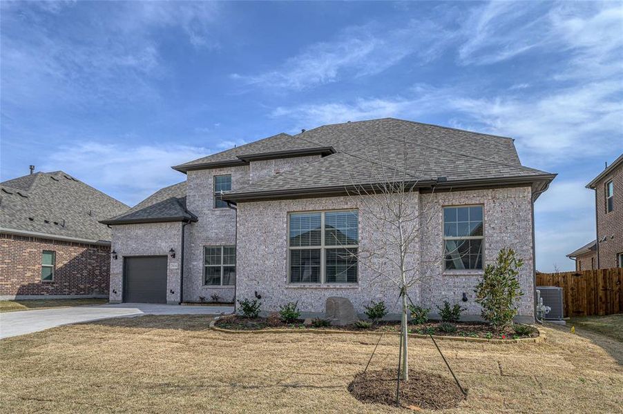 Front exterior of a new home in Estates at Baker Park, Sherman, TX, highlighting curb appeal (Image 27).