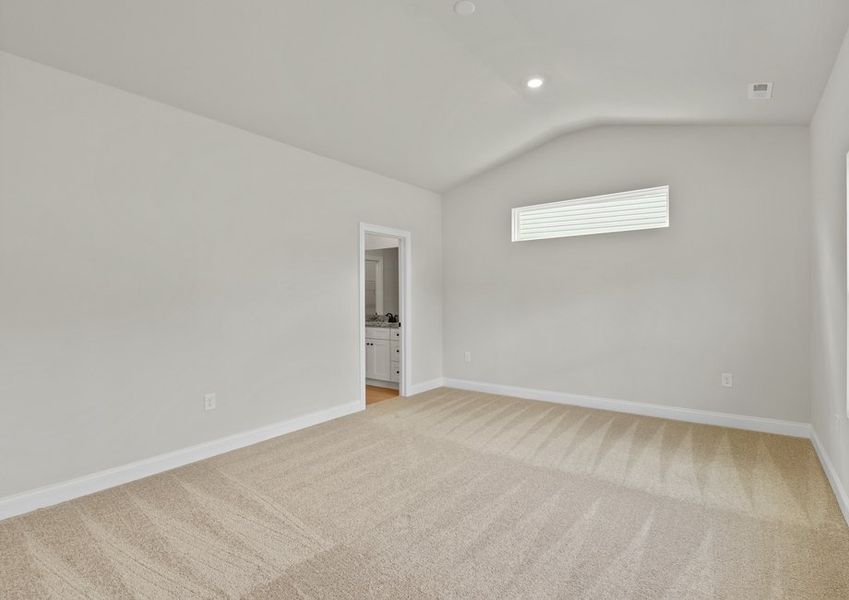 The master bedroom has cathedral ceilings