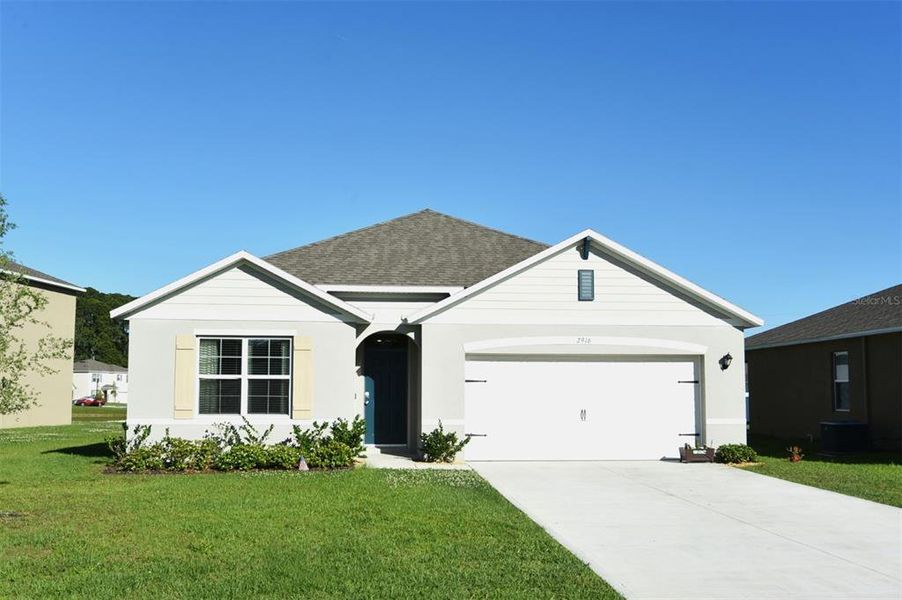 Front exterior of a new home in Greenbrier, Tavares, FL, highlighting curb appeal (Image 18).