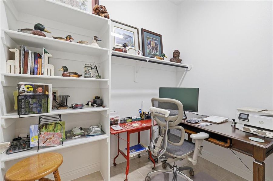 Additional Office Space or Large Storage Room conveniently Located Near the 3-Car Garage Access.