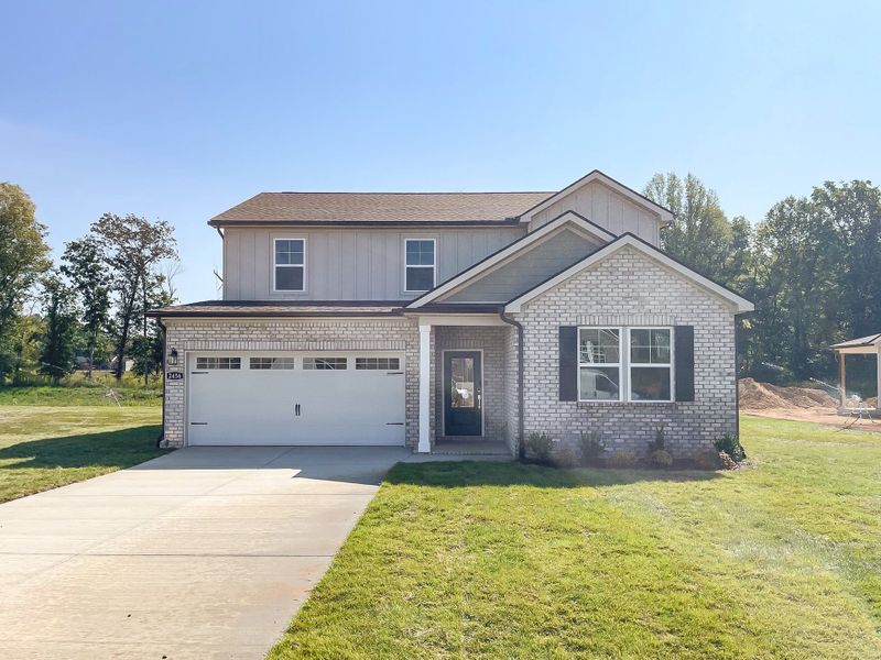 Front exterior of a new home in Highland Reserves, Pleasant View, TN, highlighting curb appeal (Image 1).