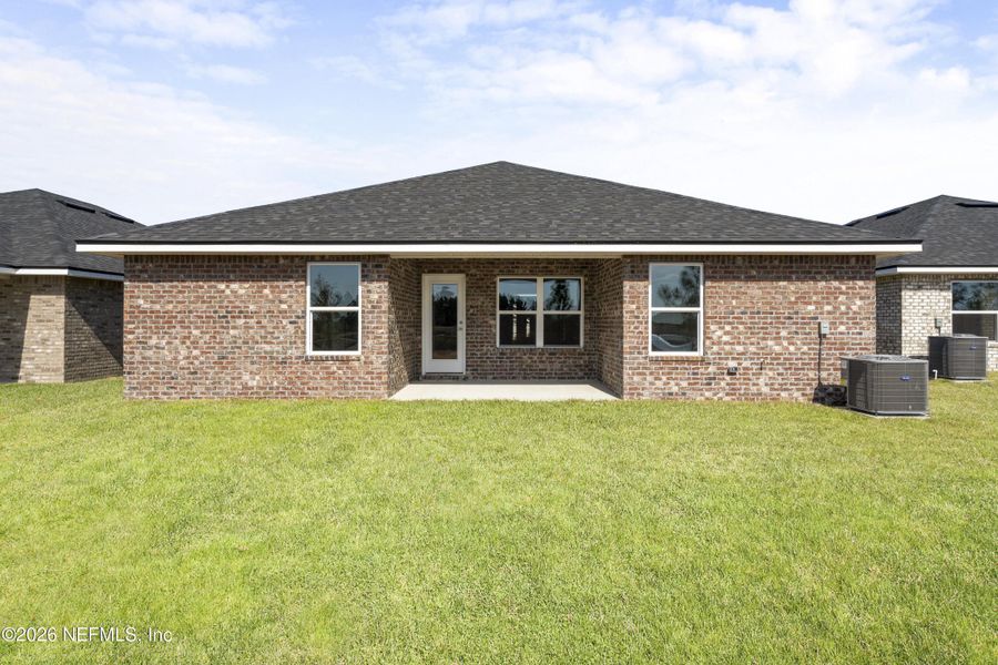Exterior details and patio area of a home in Shadow Crest at Rolling Hills, Green Cove Springs (Image 15).