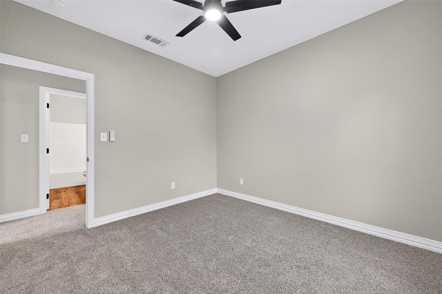 Spare room with carpet flooring and ceiling fan Spare room with carpet flooring and ceiling fan