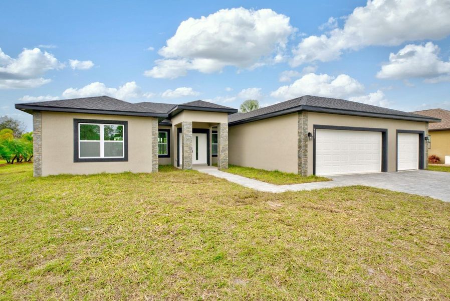 Front exterior of a new home in , Sebring, FL, highlighting curb appeal (Image 2).