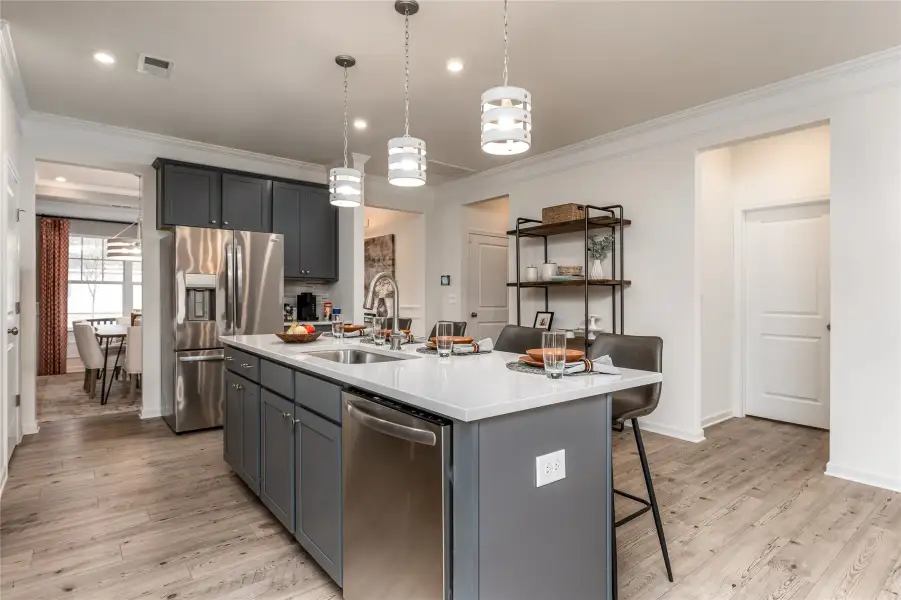 The Palmer- Kitchen. The sample image is a staged model, to be used for illustrative purposes only. Upgrades, options, and colors will vary.