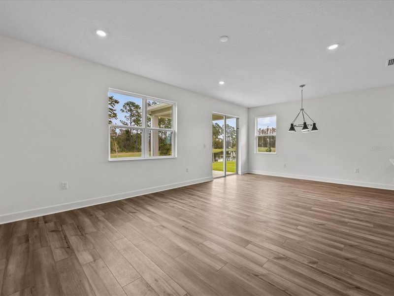 View from the main bedroom door to the living room and dining