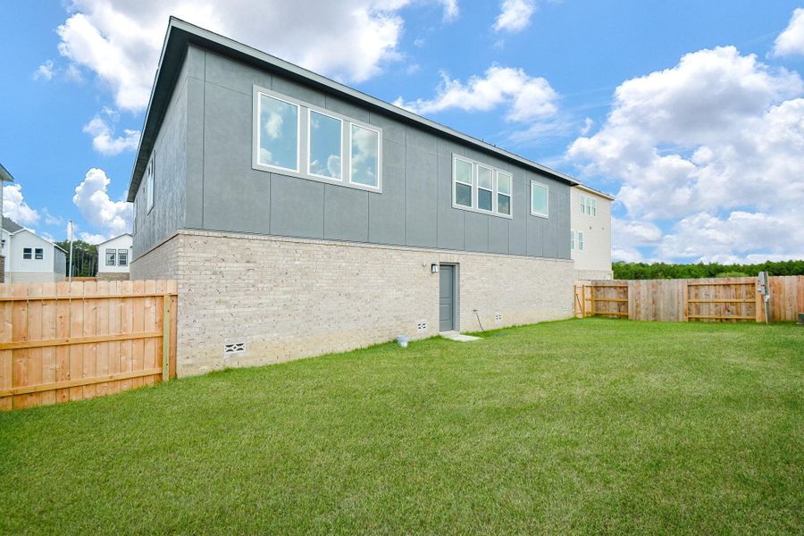 Step out onto this expansive backyard.