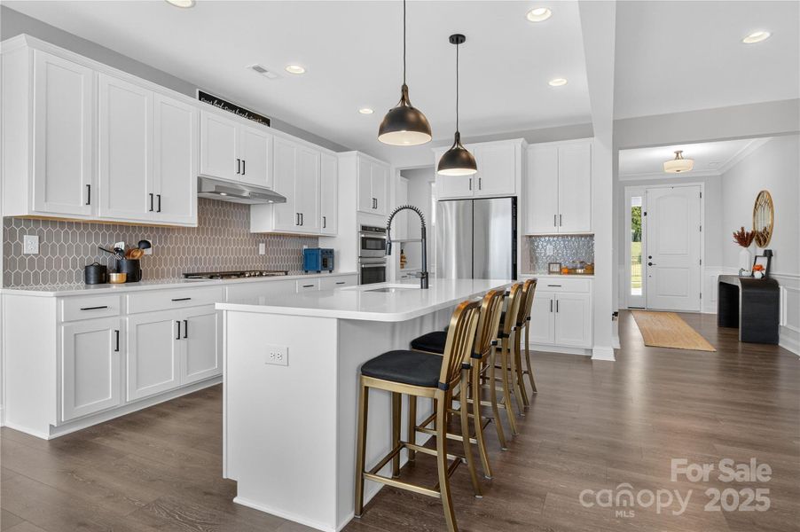 Furnished interior view inside a new home in Signature at Reid's Cove, Mooresville (Image 6). Furnished interior view inside a new home in Signature at Reid's Cove, Mooresville (Image 6).