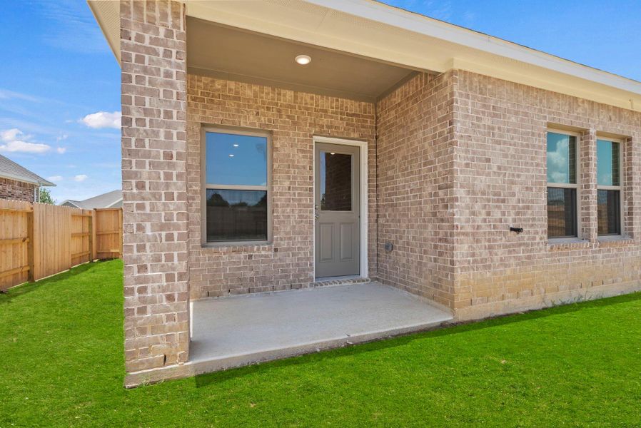 Exterior details and patio area of a home in Windcress, Cove (Image 23).