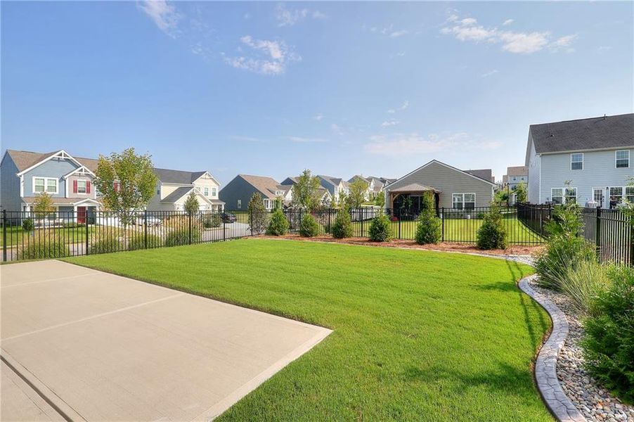 Front exterior of a new home in , Hoschton, GA, highlighting curb appeal (Image 21).