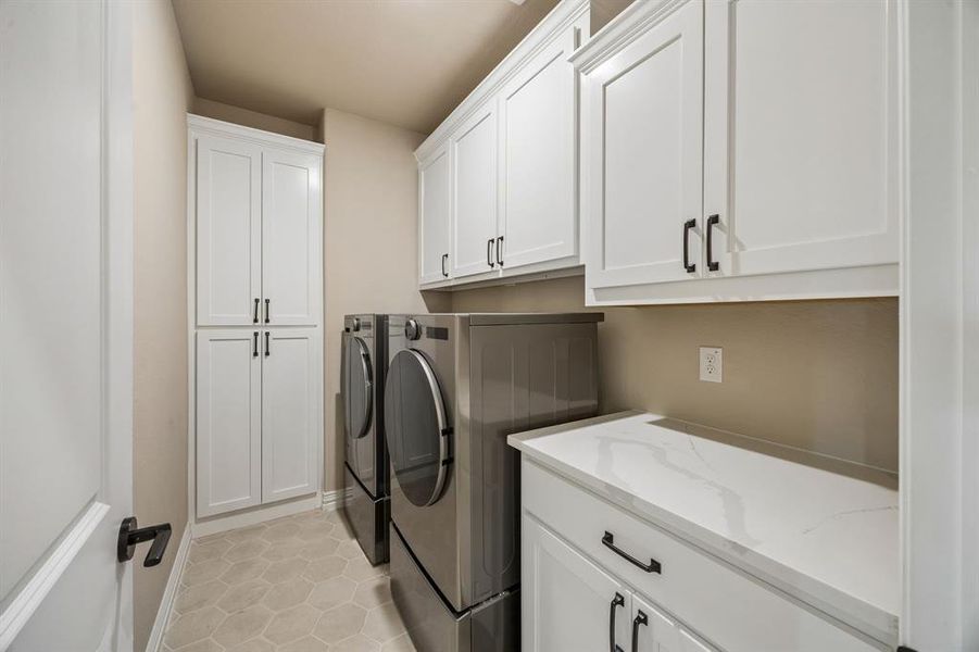 Laundry with so much storage and beatuiful custom cabintry. Laundry with so much storage and beatuiful custom cabintry.