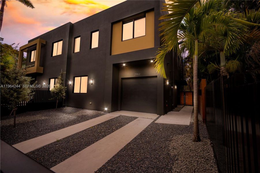 Front exterior of a new home in , Miami, FL, highlighting curb appeal (Image 1). Front exterior of a new home in , Miami, FL, highlighting curb appeal (Image 1).