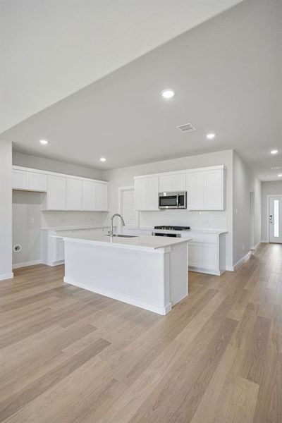 Kitchen in the Masters home plan by Trophy Signature Homes – REPRESENTATIVE PHOTO