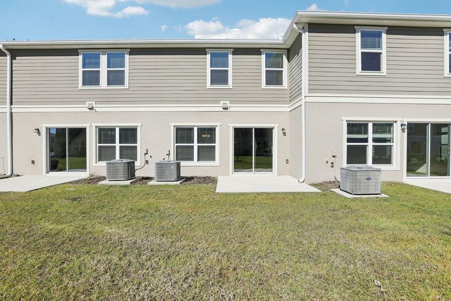 Exterior details and patio area of a home in Reserve at Forest Lake Townhomes, Lake Wales (Image 3).